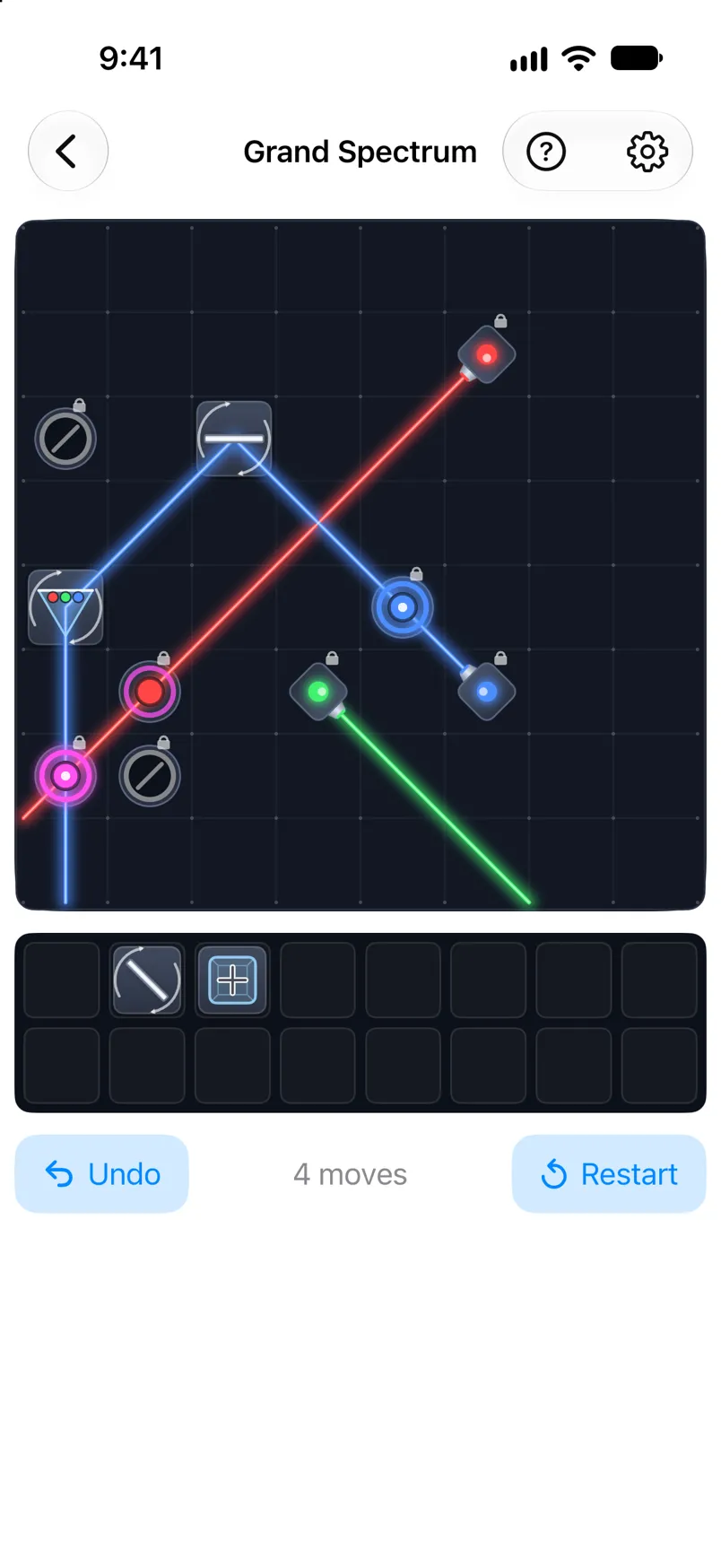 The level Grand Spectrum during a game: colored beams bounce off mirrors, with the inventory of pieces below the board.